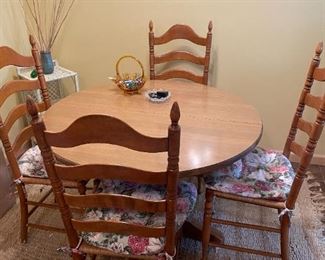 . . . a nice round table with a set of Shaker-style chairs