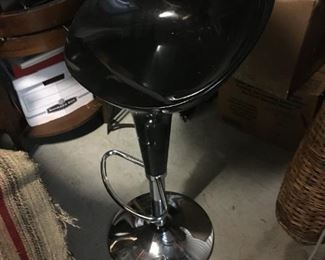 single black plastic and chrome swivel barstool $25