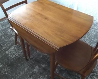 L. Hitchcock drop leaf table and 2 chairs.  (1 chair has minor damage)