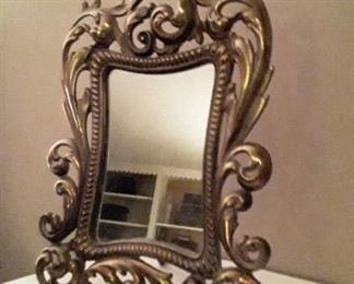 Beautiful solid brass mirror with easel. 120.00