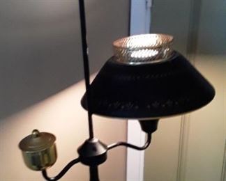 Tole table lamp with stenciled shade. Black and gold painted. 