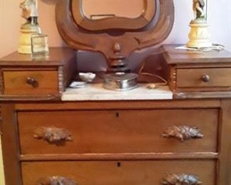 Chest with wishbone mirror. 39"H 18"D 38"W. Marble and carved handles. $325