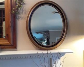 Oval gold and black Federal-style mirror. $99.00