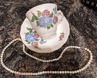 Various china tea cups with matching saucers