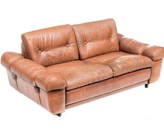 Danish Mid-Century two seat sofa, button back. brown leather, rising on short wooden legs.
27"h x 64"w x 33"d