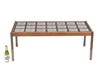 Danish Mid-Century tile top coffee table, abstract motif, wooden frame.
21"h x 56"w x 26"d