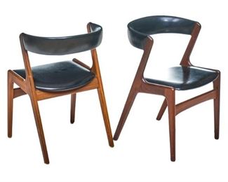 Pair of Mid-Century side chairs, black leatherette seat and demilune back, rising on wooden frame.
30"h x 19"w x 18"d/ each