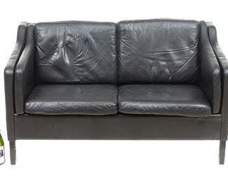 Danish Mid-Century two seat sofa, black leather, rising on wooden block legs.
29"h x 53"w x 32.5"d
