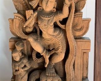 Woodcarving from India depicting the Lord Krishna dancing on Kaliya 