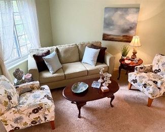 Beautiful living room sofa, chairs & tables.