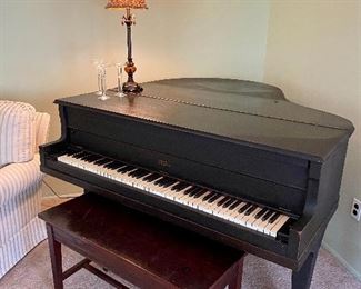 Wurlitzer Kingston baby grand piano.