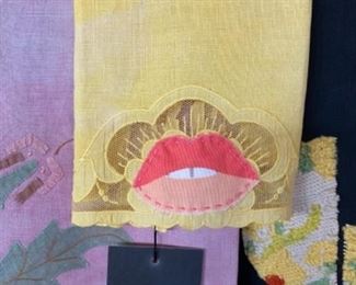 Vintage linen towel.  Turmeric natural dye and lips applique.