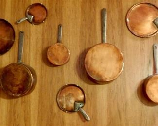 A collection of wonderful antique copper pans.