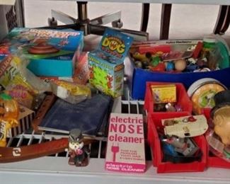 2156	

1990s Toys
Includes PEZ, Electric Nose Cleaner, Pop Pop, and More