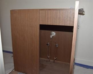 $400. Originally cost $2,400 for this brand new elegant cabinet from J and J Cabinets with marine grade finished top to accommodate bowl sink. Too deep for bathroom it was intended to go in so must be sold! 31.5" wide x 21" deep x 34" tall. Ignore dust from ongoing construction!