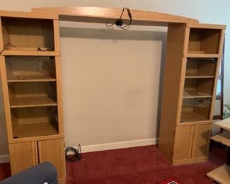 #9	entertainment center in 3 pieces (2) shelves with door and a bridge on top 21x16x71 each shelf 	 $75.00 
