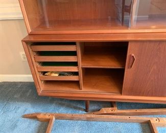 #10	Mid-Century Danish teak cabinet that can be made in to 3 pieces. Shown with long support piece on the bottom making it 88 inches long then with the extra legs and smaller support for each cabinet 59Wx18Dx30H  (2 of these) plus 4 Drawer Chest  29Wx18Dx30H 	 $1,200.00 
