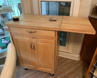 #49	Wood Rolling Butcher Block Island w/ Lift-up Side 1 drawer & 2 doors w/2 shelves  27-41Wx19Dx36	 $45.00 

