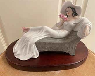 Icart porcelain Figurine on wooden base. "Parfum de Fleurs Approx 6 1/2 " tall with base measuring approx 10 1/2" long  $150 No calls/email only please. 