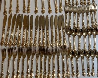 Set Rogers gold electroplated flatware. Generally good condition, some pieces excellent condition. Gold plate missing on some and some pieces heavily used. See pictures. 16 knives, 16 salad forks, 15 dinner forks, 14 teaspoons, 14 soup spoons, 4 serving pieces. Set $150.00 No calls/email only please