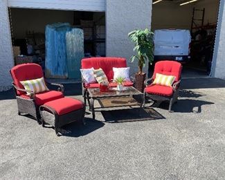 Around half a dozen different outdoor patio sets, sectionals & tables