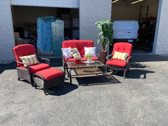 Around half a dozen different outdoor patio sets, sectionals & tables