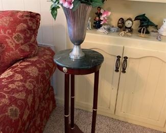 Plant stand, pewter vase with flowers 