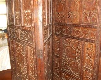 Ornate divider screen with damage