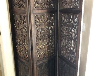 Heavily carved tri-fold wood screen