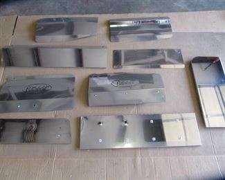 9 Assorted chrome pieces, fender guards, license plate