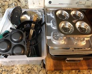 Kitchen full, including a large selection of bakeware.