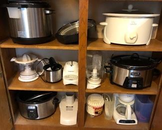 Lots of quality cookware, including enough crock pots to prepare food for a small army.