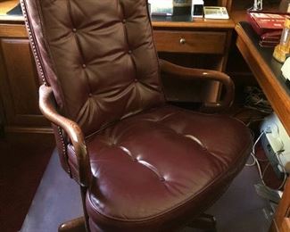 Impressive wine/burgundy leather office chair.