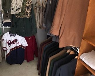 Walk-in closet full of quality men's clothing, most with limited or no wear.