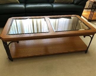 Two-panel glass-top coffee table.