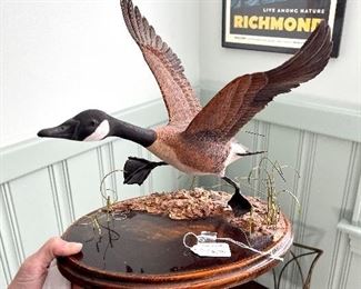 THis piece is done with metal and wood. The grasses and habitat are in metal and other materials - this duck is in perfect condition.
