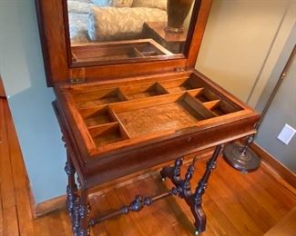 Open view of women’s dressing table with birdseye maple.  Mirror is original with wavy glass.