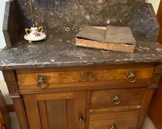 Marble-topped Antique chest and mirror showing fossil patterns in the marble.