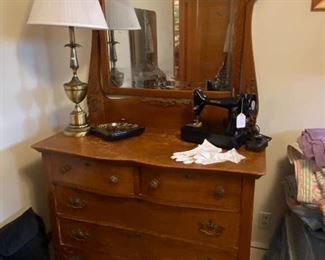 Antique dresser with mirror, ANOTHER Singer "Spartan" sewing machine, brass lamp