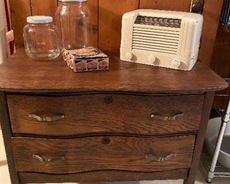 Small antique dresser on casters, vintage radio
