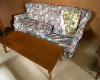 Vintage floral sofa with floral slipcover, vintage coffee table