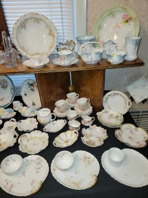 Nice assortment of 'Fancy' china pieces.  Note 3 of 8 Haviland Limoges snack sets available.  They're priced by the cup/plate set
