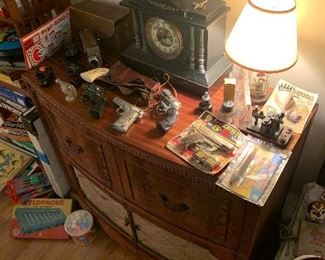 Radio bar, toy guns, visible movement mantle clock