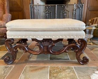 Lovely Baker upholstered bench with button accents and carved legs. Legs are carved both outside and inside of the legs. 22 1/2”H x 43”W x 19 3/4”D