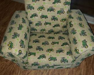 CHILDS CHAIR WITH TRACTORS ON IT