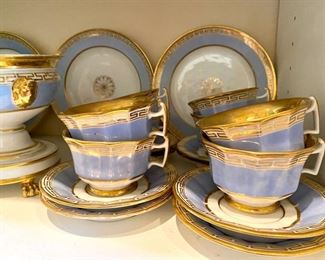 Old Paris tea and dessert service with violet and gilt Greek key border, including a footed compote
