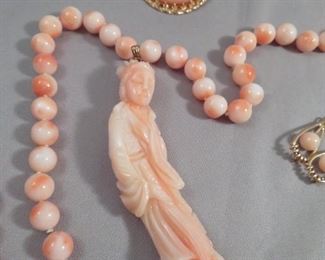 EXQUISITELY CARVED CORAL PENDANT OF GUAN YIN OR OTHER CHINESE FEMALE FIGURE.