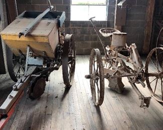 Horse drawn potato planter, horse drawn corn planter next to it