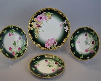 11	T&V Limoges Plate Set	Set of 3 T&V Limoges (Tressemanes & Vogt) hand painted plates, with floral decoration and gilt painted rims, and a floral & gilt painted charger, plates marked on the underside T&V for Burley & Co. Chicago. Plates each 9 1/2"-diameter; charger 12"-diameter
