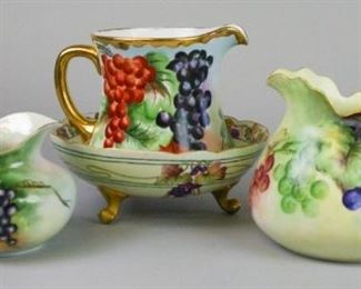 16 Grape Motif Limoges Porcelain Grouping 4 pieces of hand painted Limoges porcelain, all with grape decoration. T&V (Tressemanes & Vogt) pitcher with gilt painted rim & handle, 6"H; T&V pitcher with gilt rim, 6 1/2"H; AKD France (Klingenberg & Dwenger) footed serving bowl, 3 3/4"H x 9 1/4"-diameter; WG & Co. (William Guerin & Co.) pitcher, artist signed on the underside N. Niederfeld, 6 1/4"H
